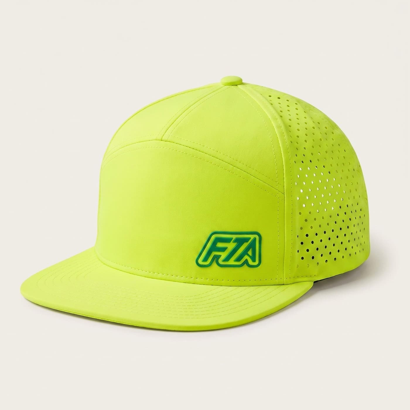 The FTA x Salt Mafia snapback in Neon Volt — flat brim, laser-cut side venting and the green FTA lettermark low on the front panel.